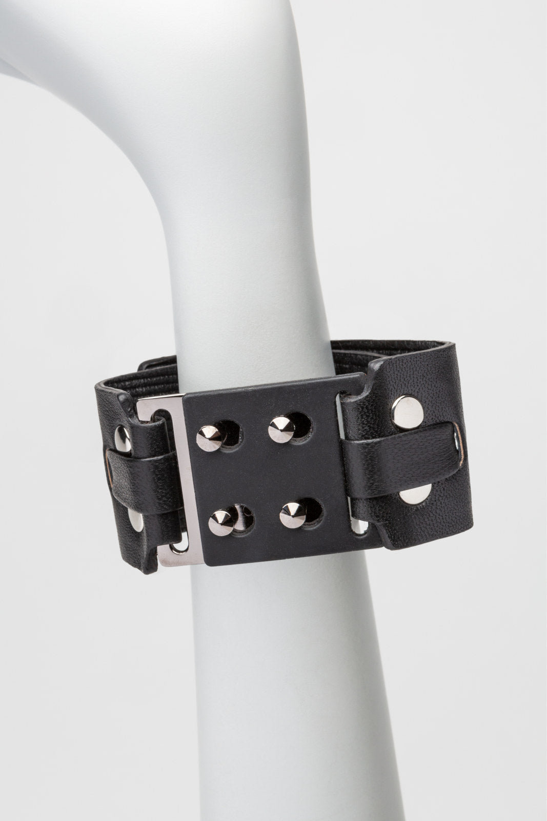 leather + metal cuff, with snap closure. 